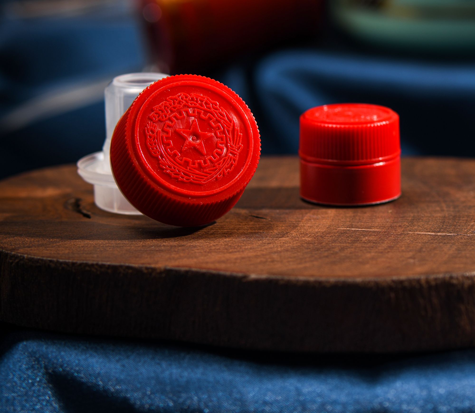 Red plastic bottle caps on wood